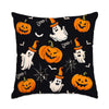 A black pillow featuring a pattern of carved pumpkins, white ghosts, and bats with 'Boo!' text.