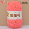 A skein of bright coral pink chenille yarn labeled in Chinese characters and marked as 6 pieces.