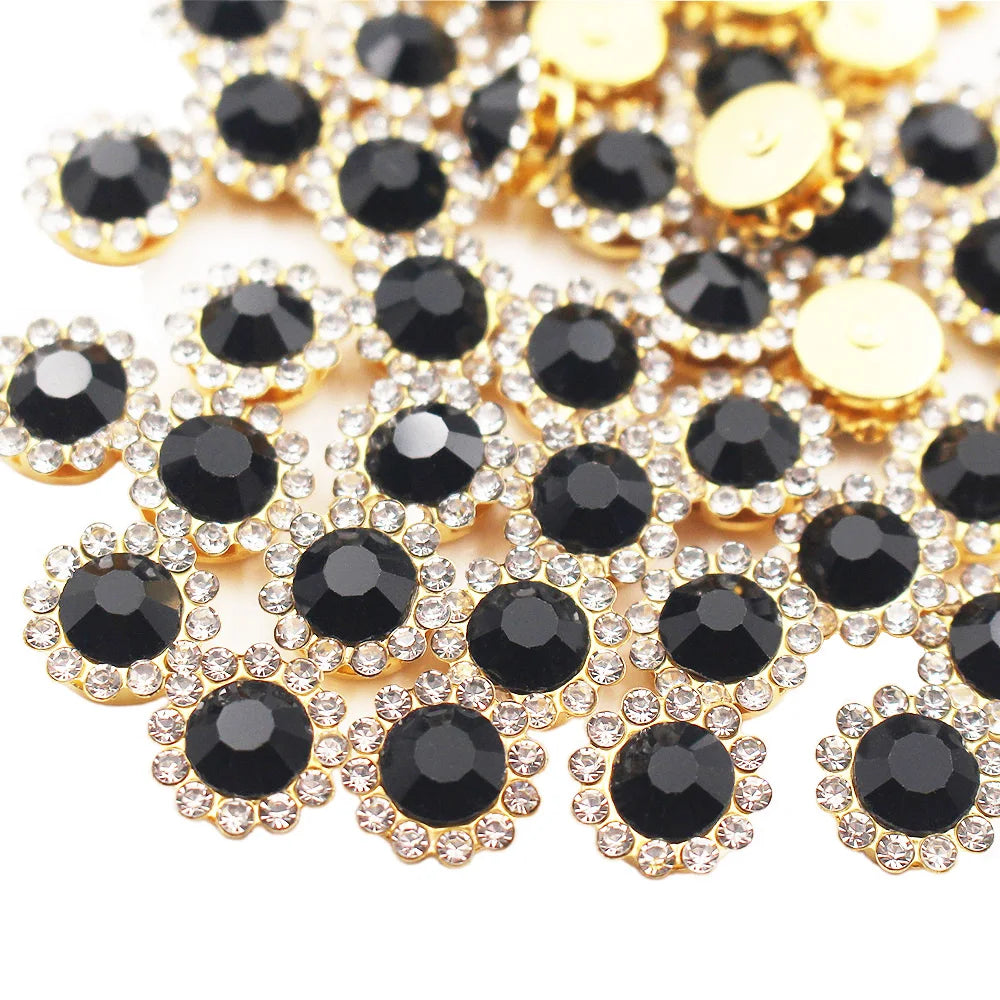 Gold and black sunflower crystal rhinestone sew-on buttons scattered on a white background