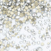 A pile of clear and gold glass rhinestones for DIY crafts