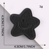 A black embroidered leather patch with a star shape is shown against a white background.