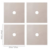 Four square beige reusable non-stick gas stove cleaning mats with circular holes for drainage