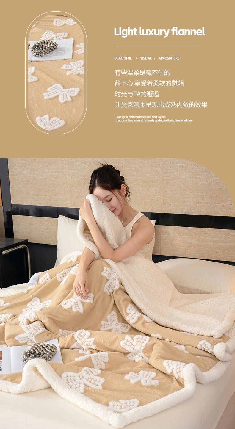 A beige and white light luxury flannel blanket draped over a bed, showing its soft texture.