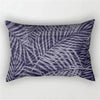 A rectangular pillowcase featuring a dark purple and gray tropical leaf print.
