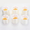 Several spools of Crystal Tec transparent elastic cord for jewelry making with various diameters labeled on the packaging