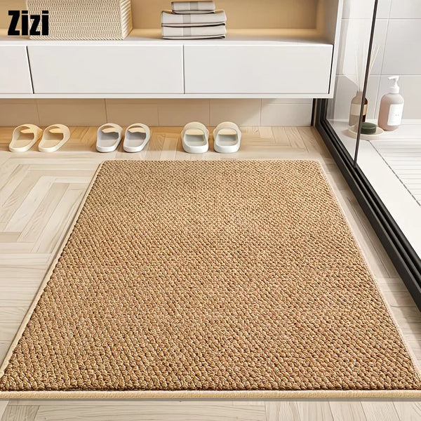 A natural sisal jute rug laid on a light wooden floor in front of white storage cabinets.