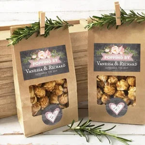 A gift bag with a wooden clothespin and jute twine for photo displays, featuring floral accents.
