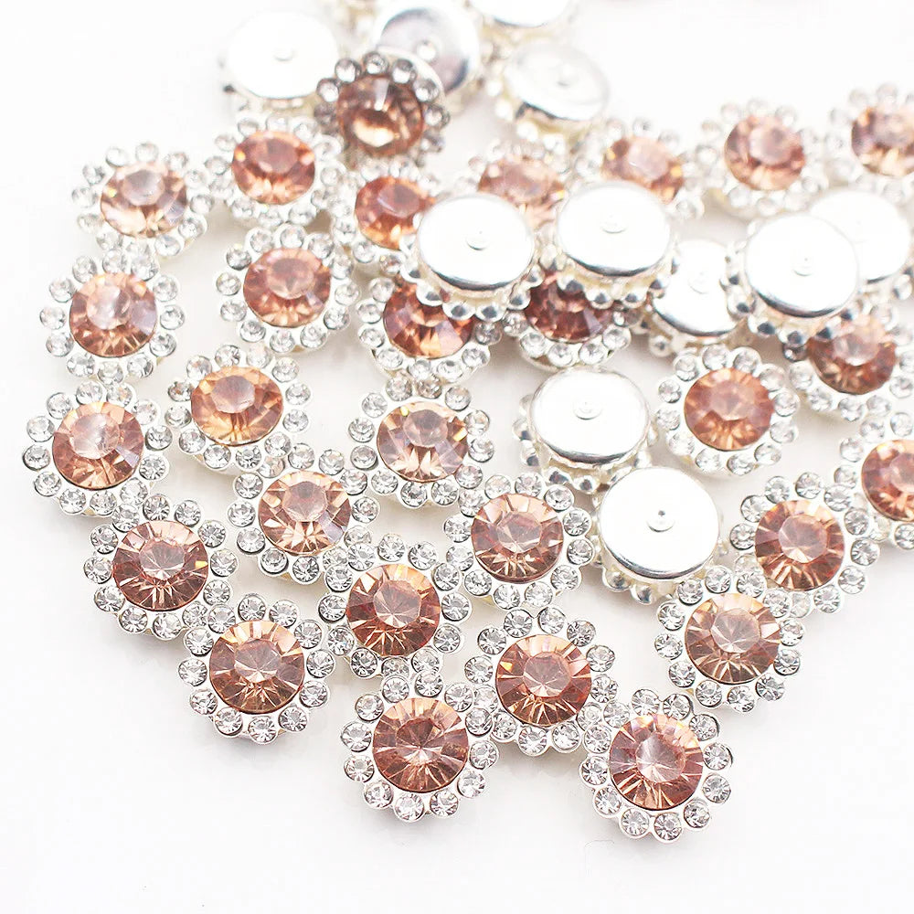 Silver and rose gold crystal rhinestone sew-on buttons arranged in a floral pattern