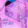 Pink crystal rhinestone sticker ribbon with diamond trim laid out next to a clear box.