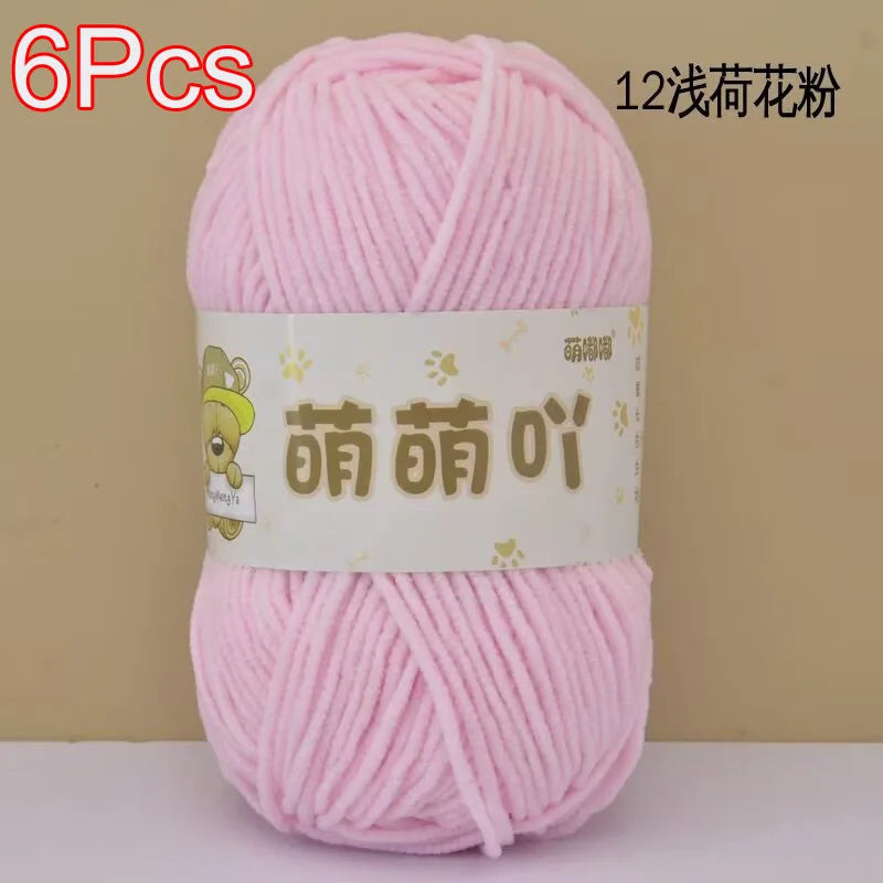 A skein of pink chenille yarn labeled as 12 strands for crochet and knitting projects.