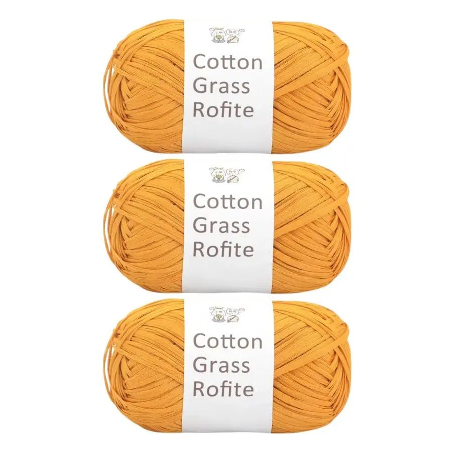 Three skeins of natural yellow cotton grass roving yarn with white labels