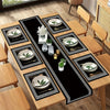 A set of luxury geometric placemats and table runners featuring silver-rimmed plates on a black background.