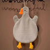 A cute cartoon goose hanging towel with orange beak and yellow feet against a neutral background.