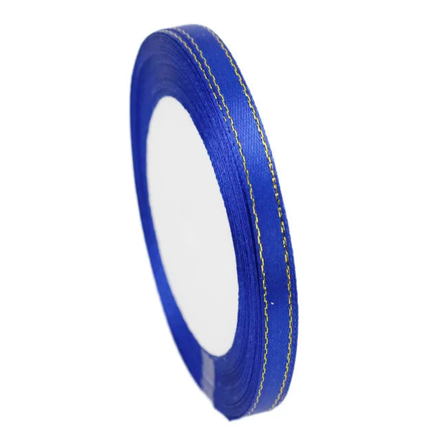 Roll of 6mm gold-edged satin ribbon in royal blue for gift wrapping and crafts