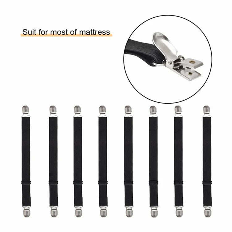 Four black adjustable bed sheet corner straps with silver metal clasps.