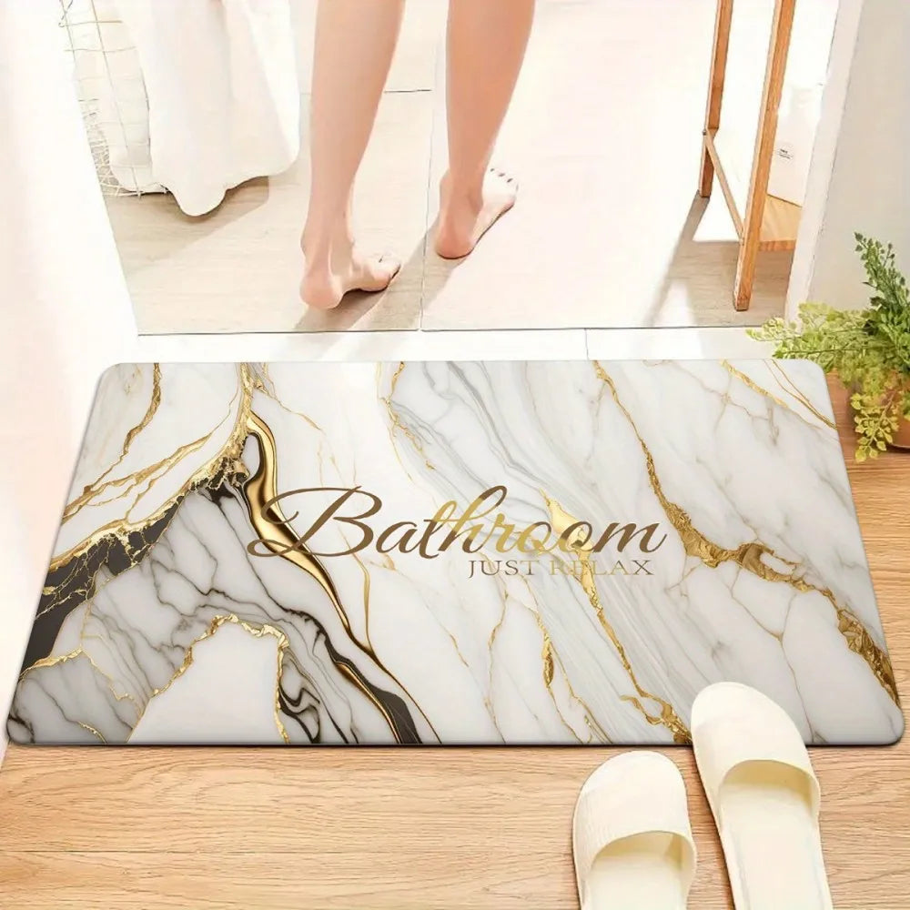 Marble pattern bath and kitchen door mat with gold veining placed on a wooden floor.