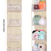 A vertical foldable over-the-door storage organizer with multiple clear pockets holding various small items.