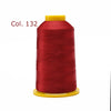 A spool of red embroidery thread labeled Col. 132 on a yellow bobbin.