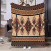 A beige flannel throw blanket featuring an ethnic print with geometric patterns in brown and maroon tones.