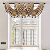 A beige European style window curtain valance with tassels draped over a white door frame.