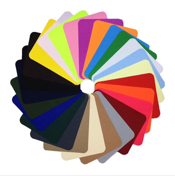 A fan of colorful iron-on fabric repair patches arranged in a circular display.