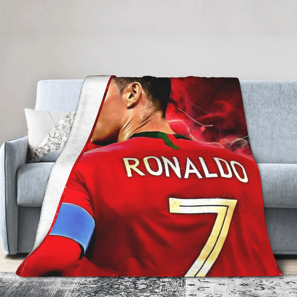 A red football jersey with the name RONALDO and number 7 printed on it, displayed as a throw blanket.