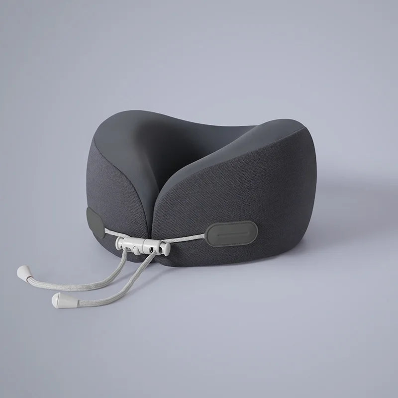 A gray U-shaped memory foam travel neck pillow with a cooling cover and adjustable strap.