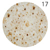 A circular image showing a light-colored, textured fabric with brown stains and a number 17 in the upper right corner.