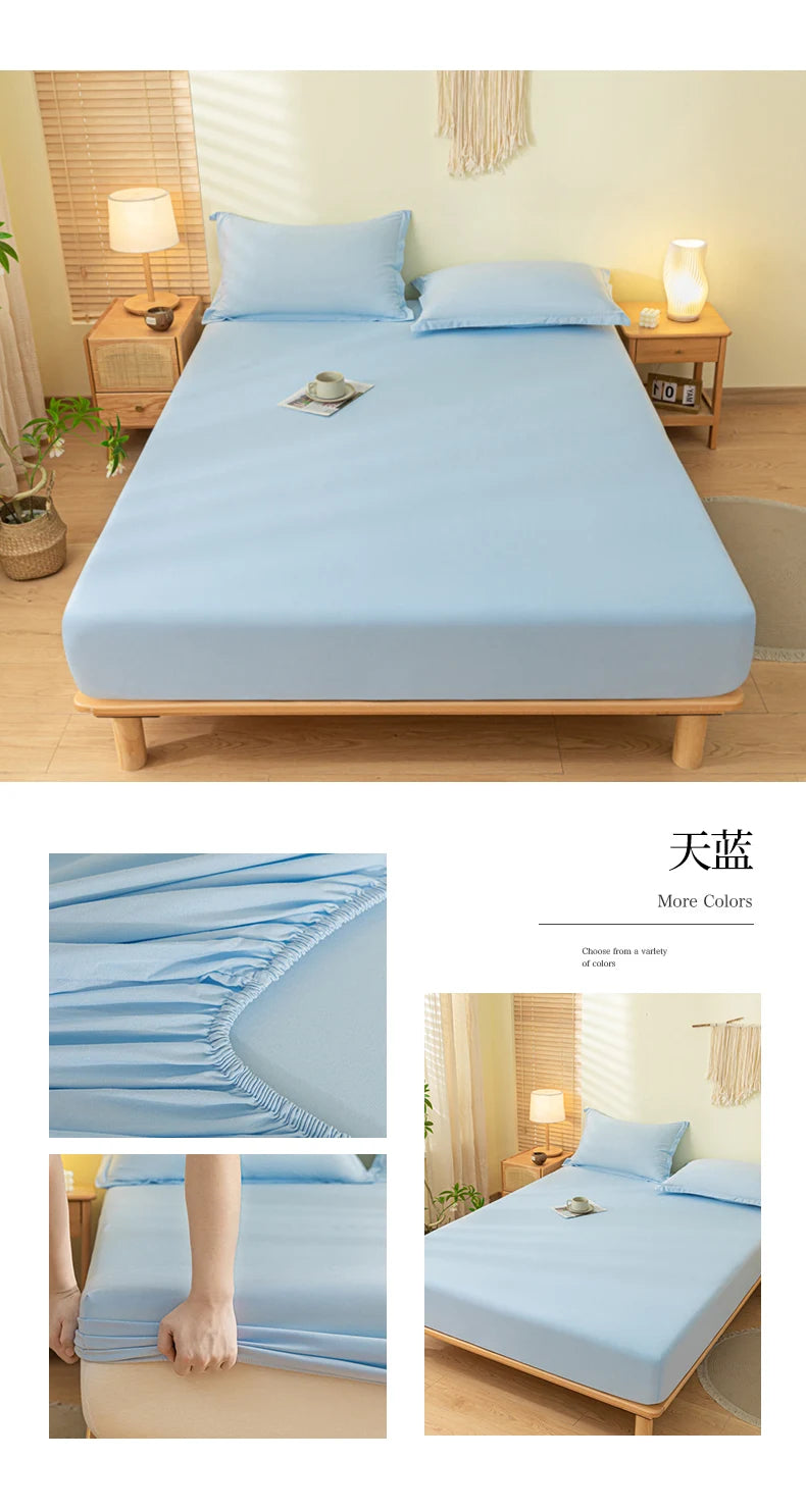 Light blue fitted bed sheet set displayed on a wooden bed frame with pillows and bedside tables.