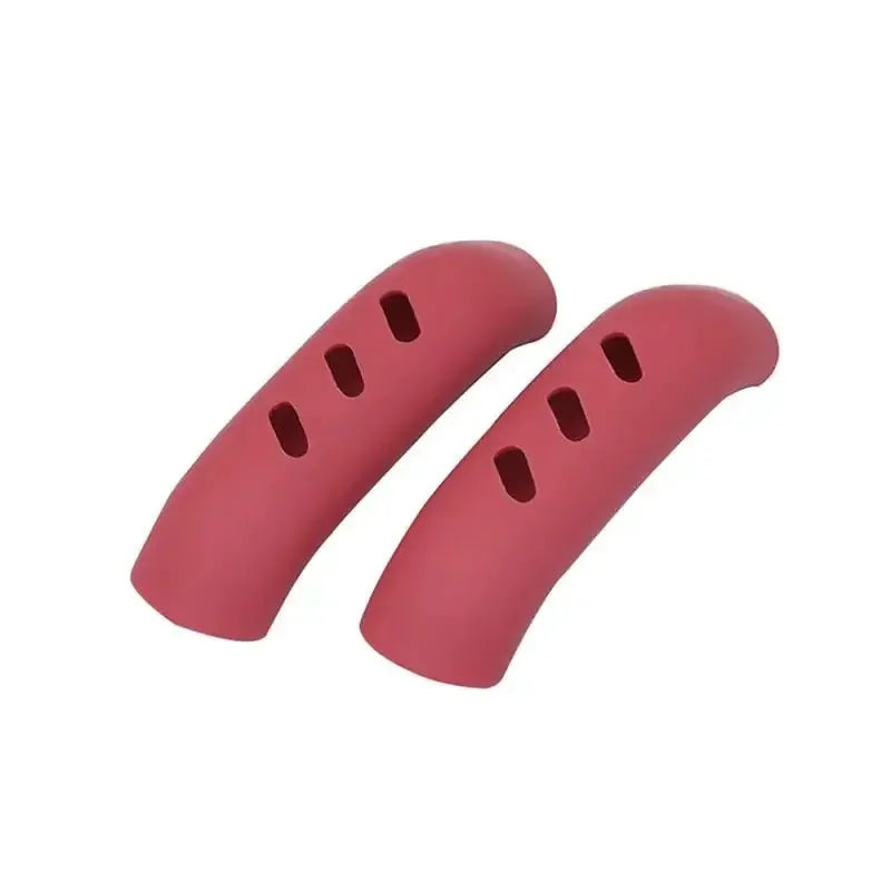 A pair of pink silicone pan handle covers designed to protect heat resistant pot handles.