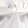 Elegant mosquito netting canopy for beds showing installation details and draped fabric.