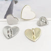 Silver and gold metal heart phone charm connectors displayed on a white background.
