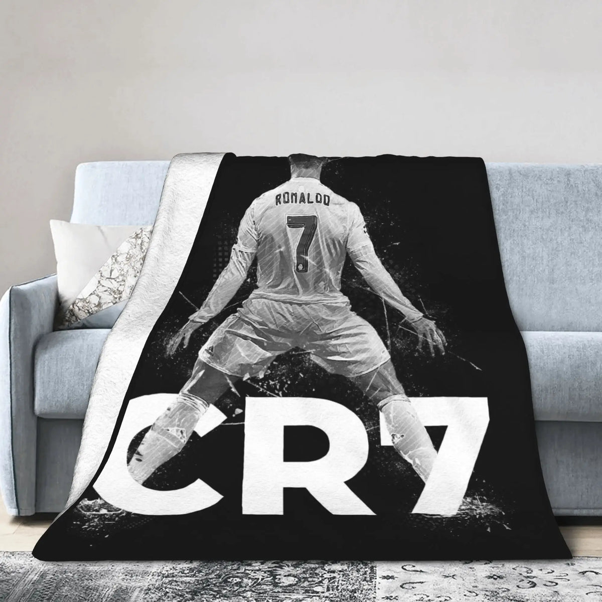 A black and white graphic blanket featuring a soccer player's back with the number 7 and the text CR7.