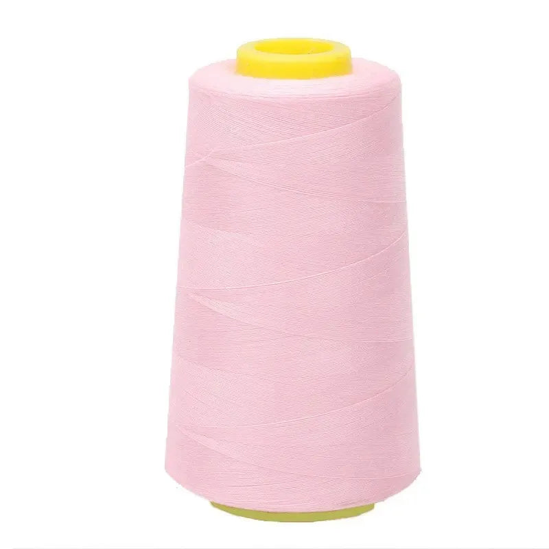 A roll of pink premium sewing thread with a yellow core.