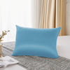 A light blue pure mulberry silk pillowcase resting on a gray textured fabric.