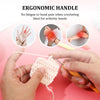 Hands using an ergonomic handle crochet hook to make a pink crocheted item.