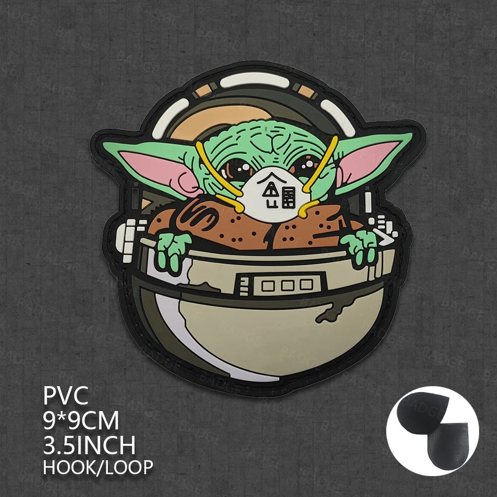A sticker featuring a green alien face wearing a helmet on a dark background.