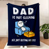 A dark blue blanket with white text that reads Dad is not sleeping and he's just besting his eyes.