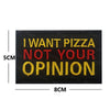 Black embroidered patch with yellow and red text that reads I WANT PIZZA NOT YOUR OPINION
