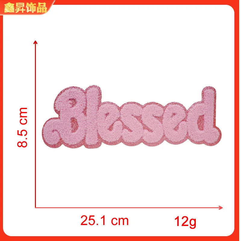 Pink felt embroidery patch with the word Blessed, measuring 8.5 cm long and weighing 12g.