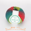 A ball of multi-colored wool yarn featuring shades of red, green, and blue, labeled for Australia waal.