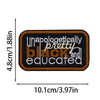 Black embroidered patch with the text unapologetically pretty black and educated