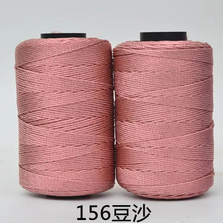 Two spools of pink hand knitting and crochet cord for crafting