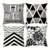 A set of four square pillowcases featuring modern geometric patterns in black, white, and gray.