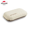 A beige inflatable camping pillow with the Naturehike logo shown on a white background.