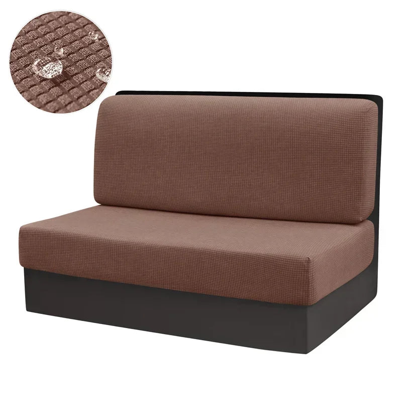 A brown stretch sofa and chair cover with a dark base, shown next to a circular swatch of the fabric.