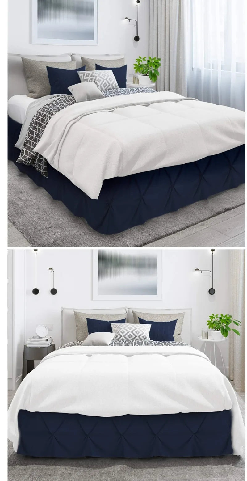 A bedroom featuring a queen bed with a navy blue quilted bed skirt and white bedding.