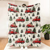 A red vintage truck Christmas throw blanket featuring multiple red pickup trucks and evergreen trees.