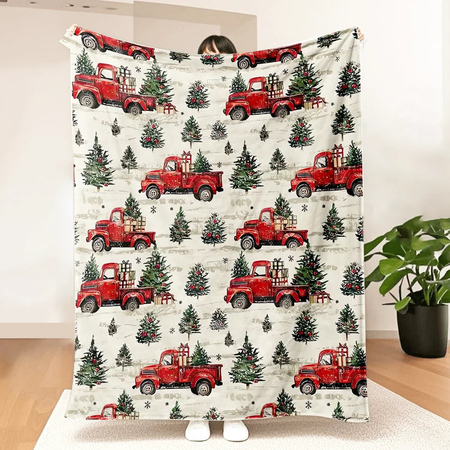 A red vintage truck Christmas throw blanket featuring multiple red pickup trucks and evergreen trees.