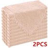 Two beige textured cloth napkins stacked neatly.